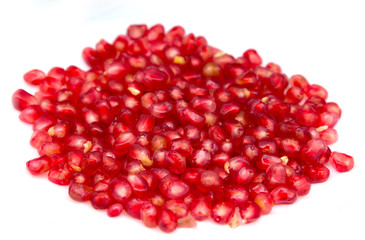 pomegranate seeds on a white background