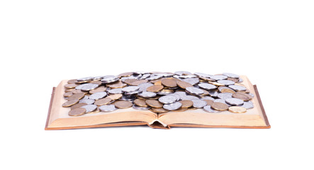 A big open book with coins.