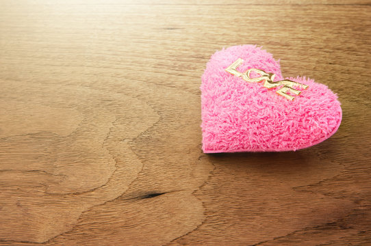 Pink heart on wood , holiday valentines background