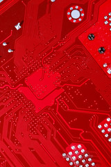 Red circuit board texture background of computer motherboard