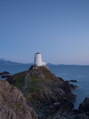 Lighthouse in North Wales on a hill in last light Llanddwyn lighthouse Newborough, Anglesey