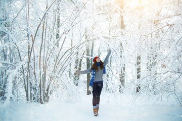 Fototapeta na wymiar winter travel girl in forest