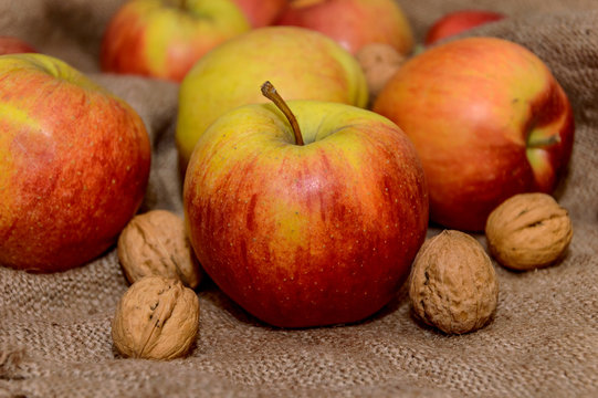 apples with nuts on a sack cloth