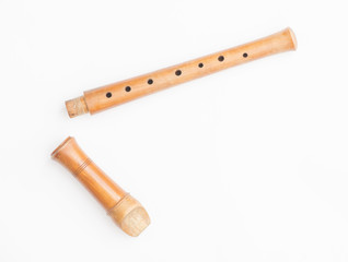 Wooden recorder on white background