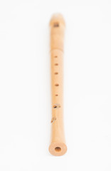 Wooden recorder on white background