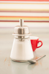 Sugar dispenser, spoon and cup