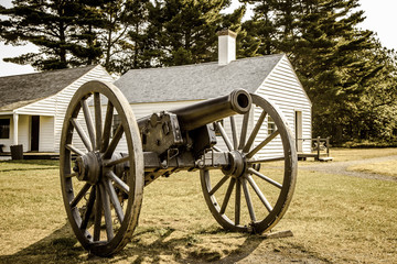 Fototapeta na wymiar Fort Wilkins State Historical Park. Antique cannon at the restored 1800's army outpost in Copper Harbor, Michigan.