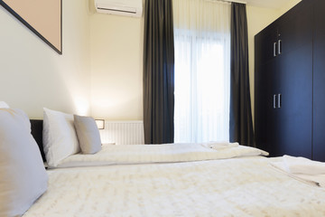 Fototapeta na wymiar Interior of a double bed hotel room