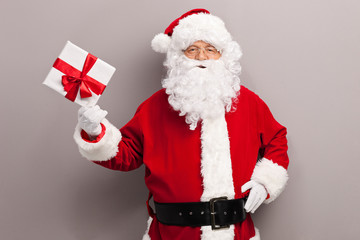 Santa Claus holding a present