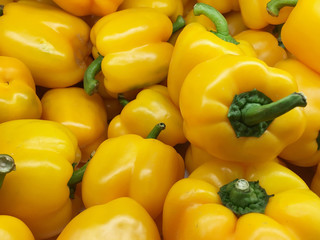 organic yellow bell peppers in market place