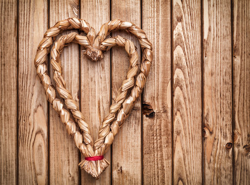 Handmade heart on wooden background