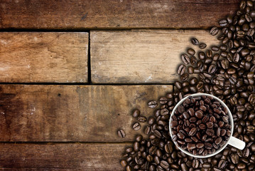 Coffee beans on wood background