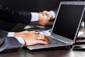 Close up of businessman's hand working with laptop 