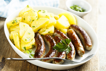 Fried sausages with potato salad