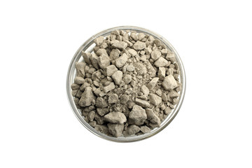 dry cosmetic clay in a bowl on white isolated background
