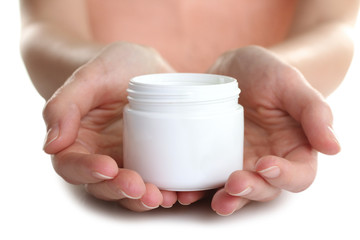 The woman is holding an outdoor moisturizer on white isolated background