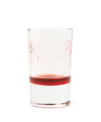 Glass shot with grenadine leftovers