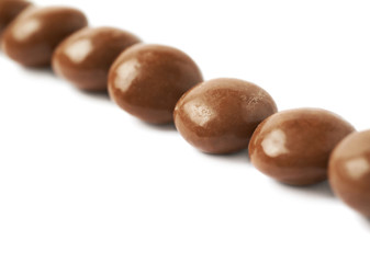 Chocolate glazed nut candies isolated