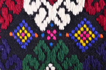 Bulgarian hand embroidery texture in old style with woolen thread