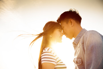 Smiling Couple in love with sunlight background