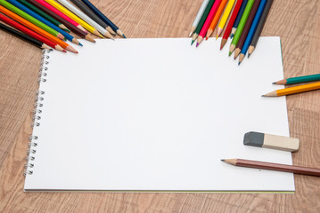 empty white sheet of paper with color pencils