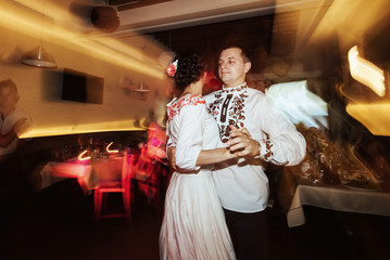 stylish bride and happy groom in the restaurant, first emotional