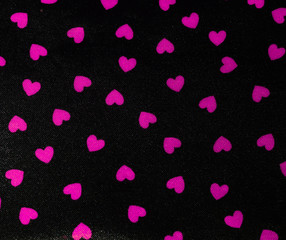 Black background with pink hearts