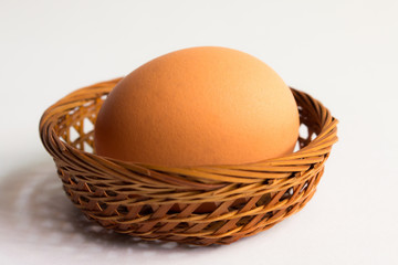 egg in basket wicker on white background,Duck eggs in baskets .