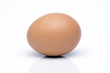Egg on white background with reflection on floor