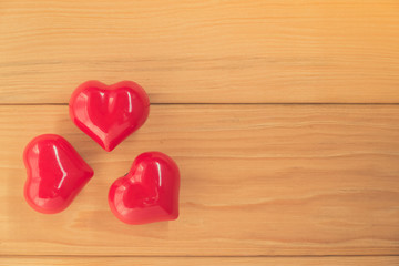 red heart on rustic wood with copy space