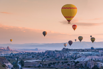 Fototapeta na wymiar Hot air balloons fly over Cappadocia