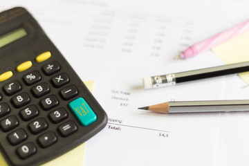 a calculator is on a balance sheet numbers are statistics. photo