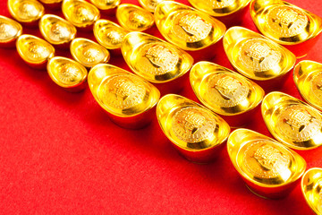 Chinese Gold ingot (Sycees, YuanBao ) are used a symbol of prosperity among Chinese people. representing a fortunate year to come. On red color background