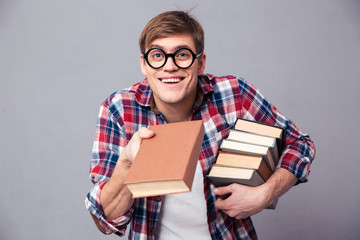 Playful man in funny round glasses giving youn a book