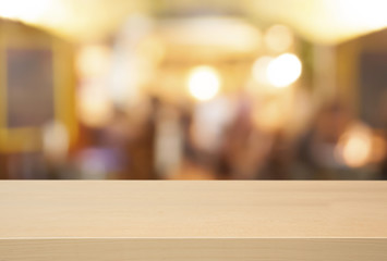 Empty wooden table and blurred cafe background, product display        