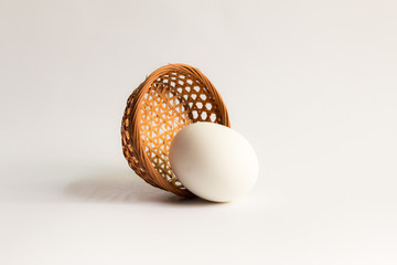 egg in basket wicker on white background,Duck eggs in baskets .