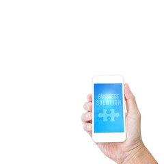 Hand holding mobile phone with Business solution word isolated o