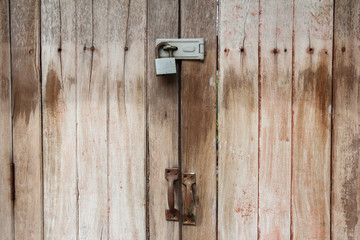 Locked Key On Old Wooden Door