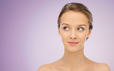 Fototapeta premium smiling young woman face and shoulders