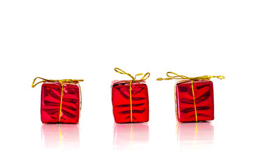 3 small christmas red presents on white background
