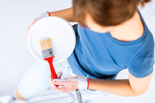 Woman With Paintbrush And Paint Pot