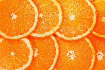 orange background chopped circle closeup oranges