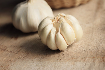 heap garlic on wood background