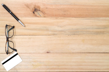 Office table , Blank white credit card with black pen , View from top.