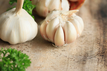 heap garlic on wood background
