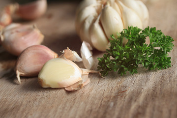 heap garlic on wood background