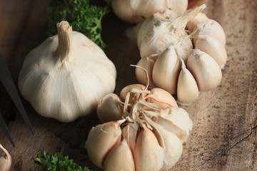 heap garlic on wood background
