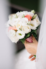 Bride holding a bouquet of flowers, wedding bouquet