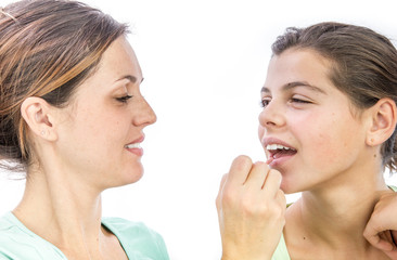 pretty young woman  applying make-up a girl smiling