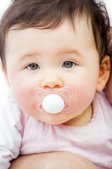 closeup of a cute baby on a white background